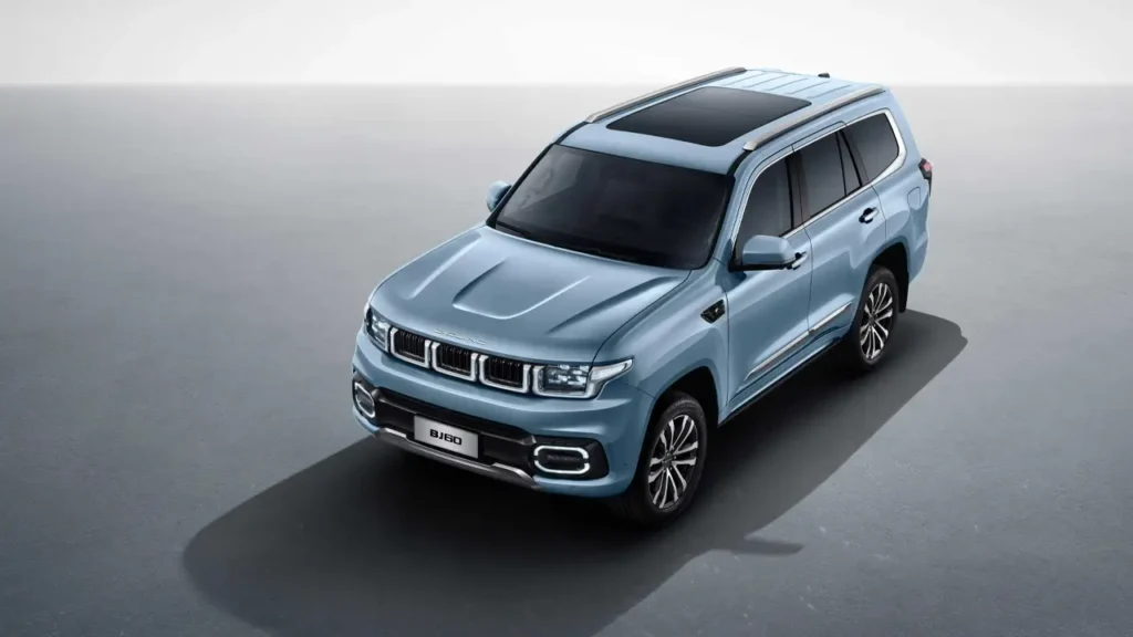 Light blue BAIC BJ60 on asphalt, front angled view with panoramic sunroof.