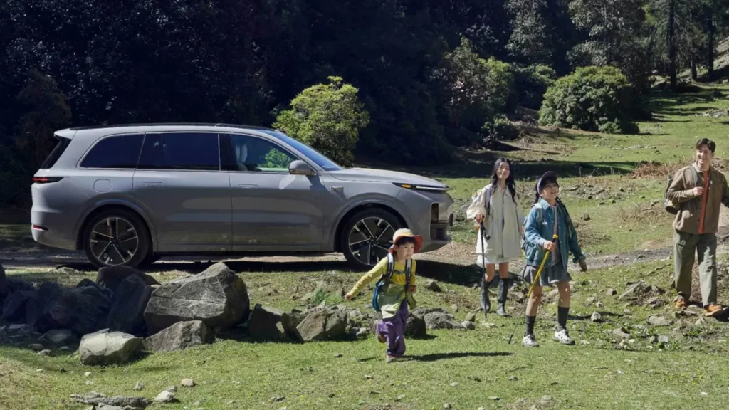 "Family adventure with Chinese cars: modern SUV parked in nature as a family prepares for a hike."