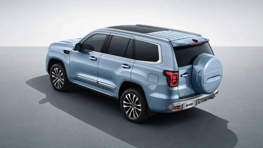 Rear angled view of the BAIC BJ60 with covered spare tire and panoramic roof.