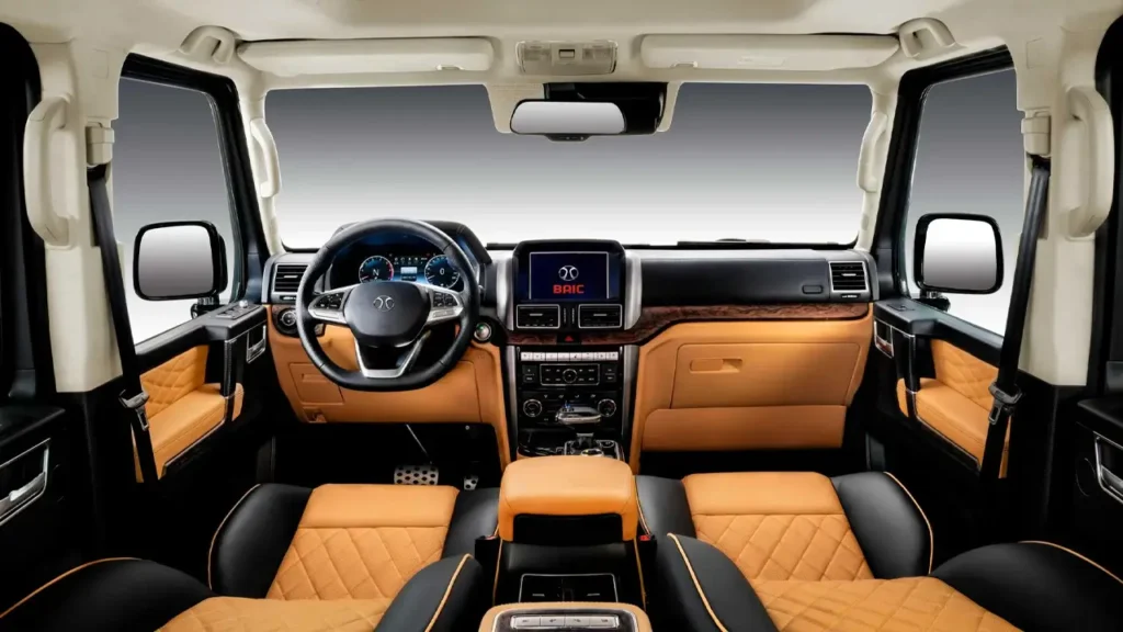 Interior of the BAIC BJ80 SUV showing the steering wheel, dashboard, and luxury leather seats.