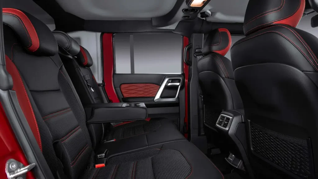 Rear seats of the BAIC BJ40 Plus featuring red and black upholstery and modern interior styling.