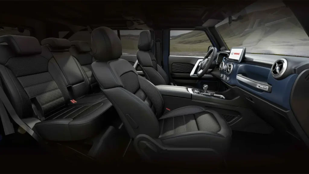 Full view of BAIC BJ40 Plus interior: front and rear seats, center console, and infotainment display.