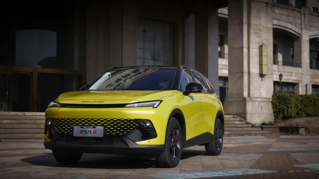 Yellow BEIJING X55 II parked near the steps of an administrative building