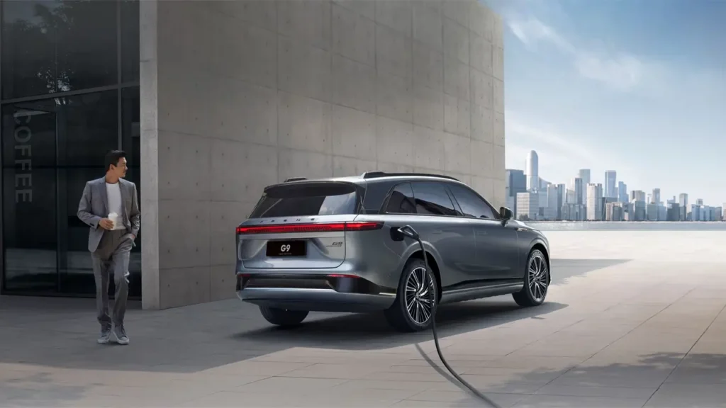 Xpeng G9 charging next to office building