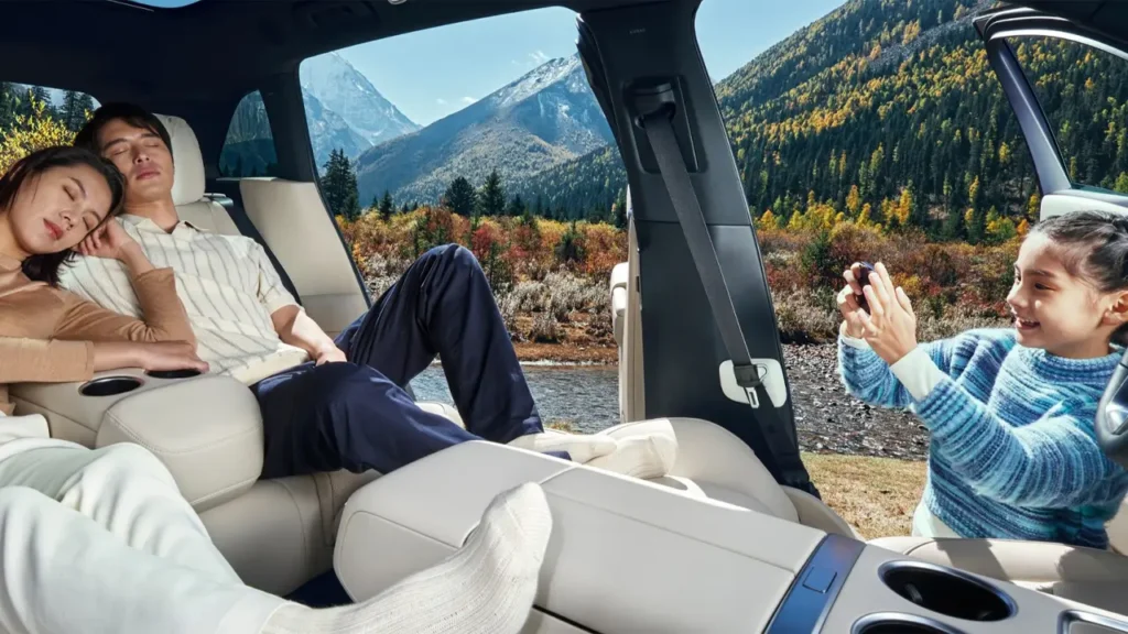 Interior of Li L7 electric SUV with passengers relaxing during a nature trip