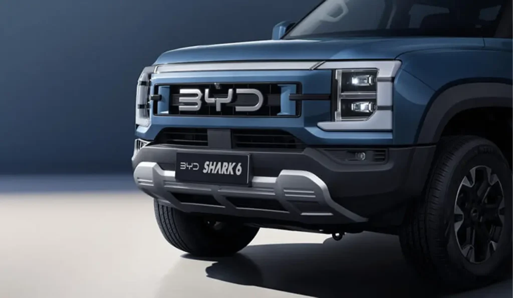 Review of BYD SHARK 6 — Hybrid Pickup from China | AutoChina Close-up of the front grille and headlights of BYD SHARK 6