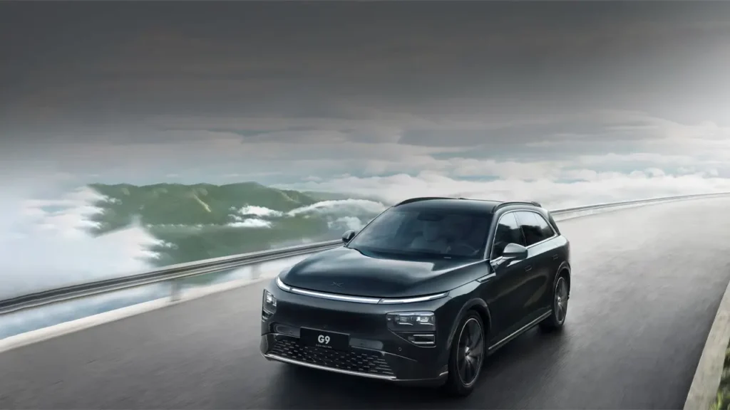Xpeng G9 driving along a mountain highway