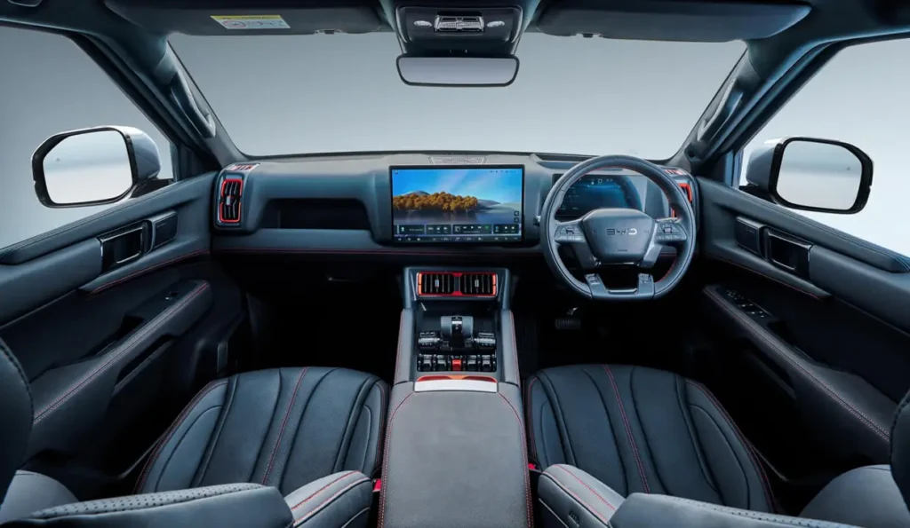 Review of BYD SHARK 6 — Hybrid Pickup from China | AutoChina Interior cockpit view of BYD SHARK 6 with digital dashboard and touchscreen
