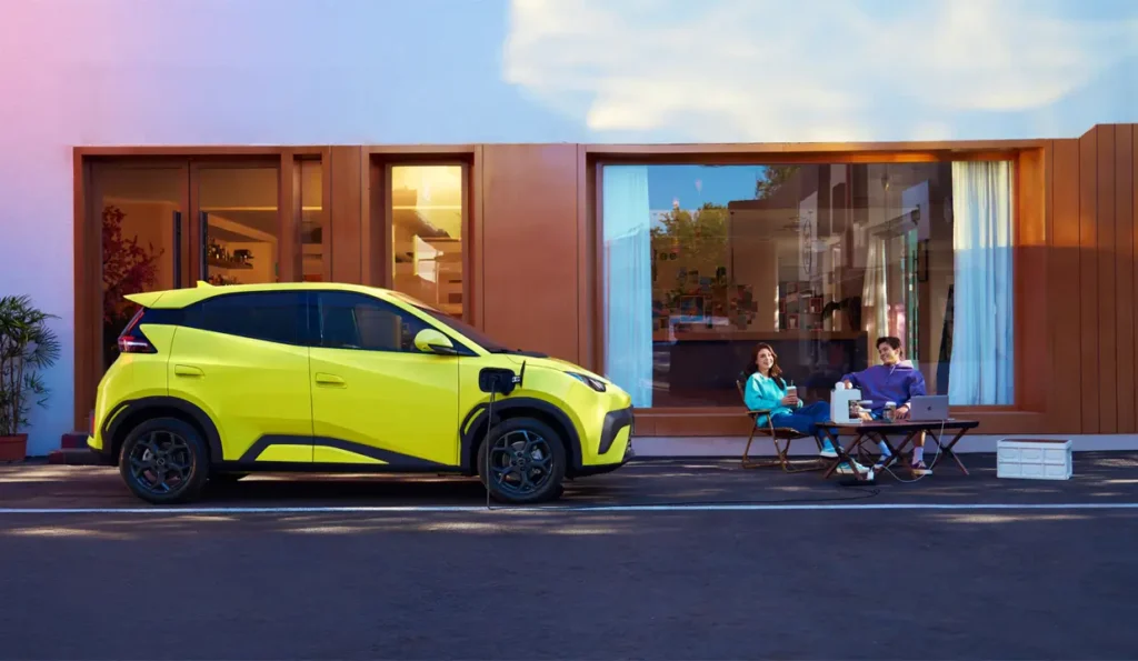 BYD Dolphin SURF parked while couple relax outside
