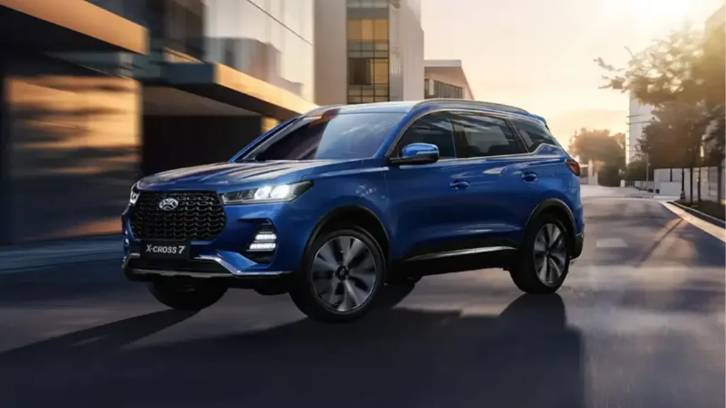 XCITE X-Cross 7 SUV driving in the city at sunset